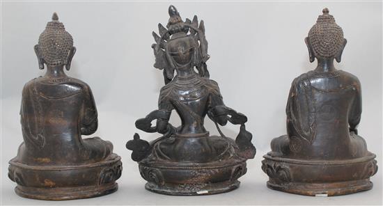 Three A Sino-Tibetan bronze seated figures of Buddhist deities, 20-21cm high